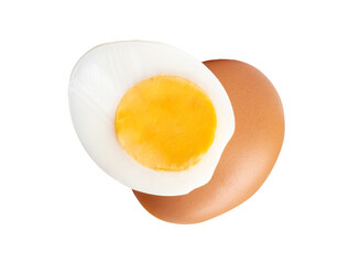 Front view of raw brown chicken egg and cooked or boiled chicken egg with egg yolk in half in small pile isolated on white background with clipping path