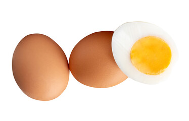 Front view of raw brown chicken eggs and cooked or boiled chicken egg with egg yolk in half in small pile isolated on white background with clipping path