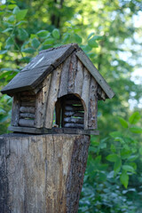 wooden feeder for forest animals in the park