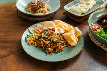 Stir fry noodle with crackers indonesian food nusantara