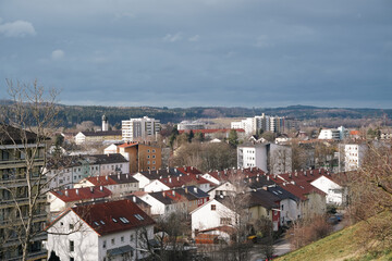 Obraz premium Urban landscape view of a residential area in Germany under a cloudy sky in early spring