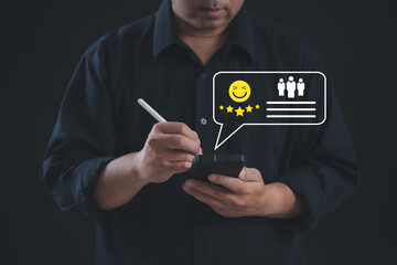 Professional using stylus on smartphone to submit a five-star review with smiling emoji icon, representing positive customer feedback, excellent service rating, user satisfaction, digital experience.