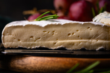 Different types of cheese, wine and grapes