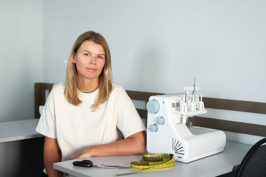 Woman in sewing workshop with sewing machine