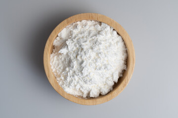 Close-up of tapioca starch or flour powder in spoon with white background