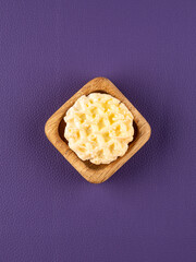 close up of the  cute cookie shaped hairpin on purple background