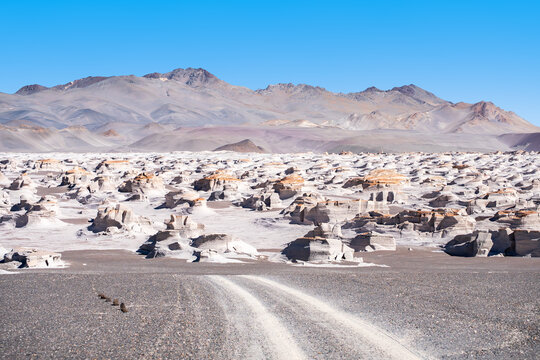 Scenic desert road winding through the rugged terrain of La Puna, Argentina