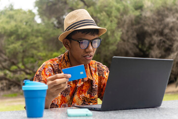 Indonesian in Australia wearing batik, working outdoors