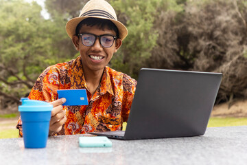 Indonesian in Australia Wears Batik While Online Shopping