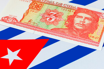 3 Pesos of Cuba with a portrait of Ernesto Che Guevara on the background of the Cuban flag. Vintage money of Cuba.