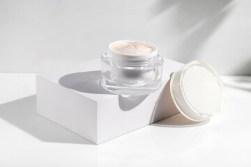 makeup cosmetic medical skin care, a mockup for cream lotion bottle product, packaging on white  waterdrop fresh with glass background