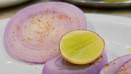 Selective focus on Onion and Lemon.