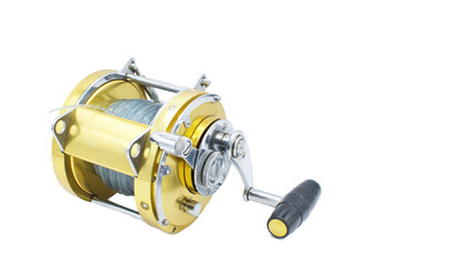 Large gold color salt water fishing reel is a hand cranked reel used in angling to wind and stow fishing line, typically mounted onto a fishing rod. Used for deep sea water fishing for big fish