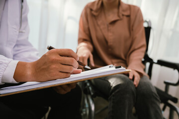 Doctors provide emotional support and medical care to wheelchair patients, symbolizing compassion,...