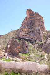 Uchisar Castle or Kalesi, a unique cave building, carved from volcanic rock at the highest point of...
