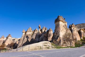 Fairy chimneys at Zelve and Pasabaglar Archaeological Site in Goreme, Cappadocia, Turkiye - Red...