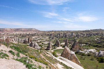 Panorama view of Uchisar castle and fairy chimneys, natural volcanic rock formations and the red...