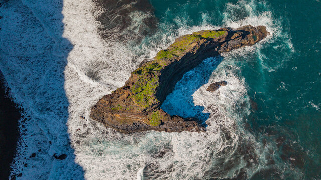 Aerial view of roque de las tabaidas with beautiful waves and rocks, Garafia Town, La Palma Island, Canary Islands, Spain.