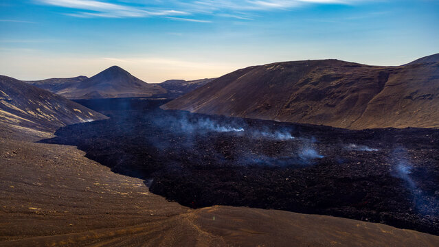 Aerial view of the majestic Fagradalsfjall volcano with flowing lava in a scenic landscape, Grindavik, Sudurnes, Iceland.