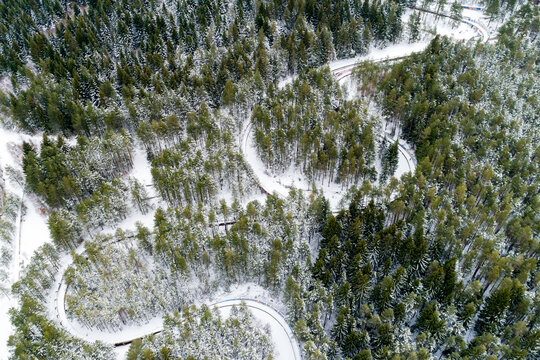 Aerial view of former Olympic bobsleigh track surrounded by snowy forest and trees, Sarajevo, Bosnia and Herzegovina.