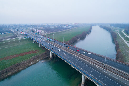 Aerial view of roundabout construction site with road and bridge over river, Zagreb, Croatia.