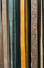  Western ffashion leather belts hanging in a rack