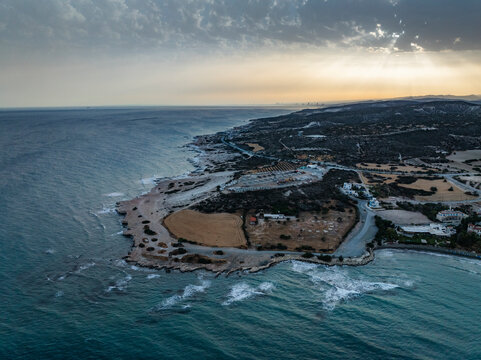 Aerial view of beautiful coastal landscape at sunset with serene sea and picturesque shore, Pentakomo, Limassol, Cyprus.