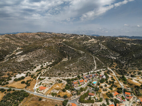 Aerial view of picturesque Troodos Mountains with serene village and scenic roads, Skarinou, Larnaca, Cyprus.