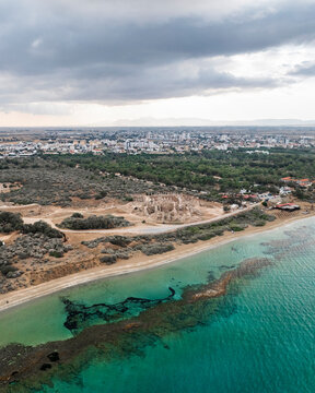 Aerial view of ancient Salamis ruins along the beautiful coastline with sandy beach and clear sea, Agios Sergios, Famagusta, Turkish Republic of Northern Cyprus.