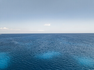 Aerial view of beautiful azure sea and tranquil sky with a picturesque horizon, Agia Napa, Famagusta, Cyprus.