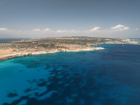 Aerial view of the beautiful blue lagoon and pristine coastline, Cape Greco Peninsula, Famagusta, Cyprus.