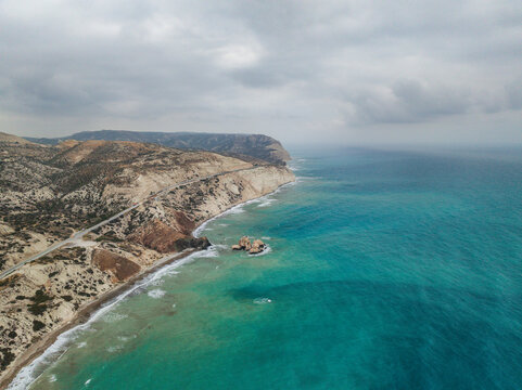 Aerial view of beautiful Aphrodite Beach with cliffs and azure waters, Kouklia, Paphos, Cyprus.