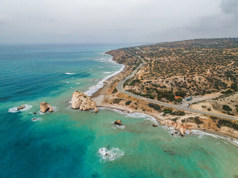 Aerial view of beautiful Aphrodite Beach with tranquil sea and picturesque rock formations, Kouklia, Paphos, Cyprus.