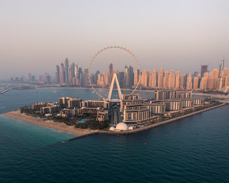 Aerial view of beautiful Blue Water Island with modern skyscrapers and a Ferris wheel by the sea, Dubai, Dubai, United Arab Emirates.