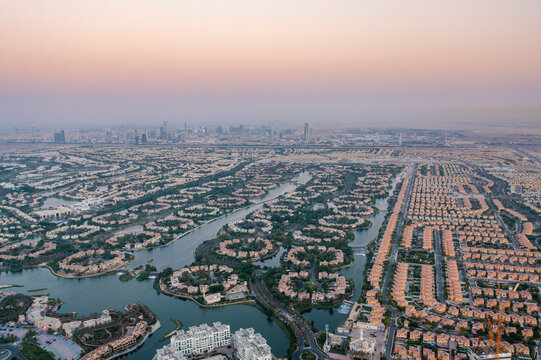 Aerial view of jumeirah islands with luxury residential buildings and waterways at sunset, Dubai, United Arab Emirates.