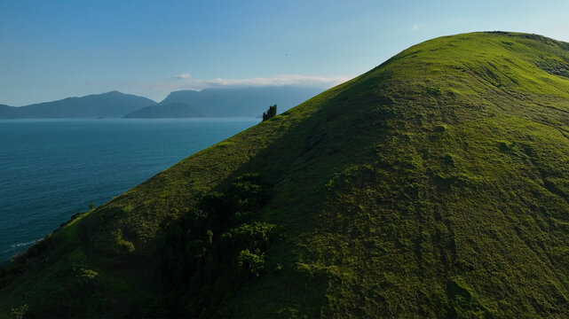 Aerial view of tropical archipelago with lush islands and majestic mountains overlooking the ocean, Ubatuba, Sao Paulo, Brazil.