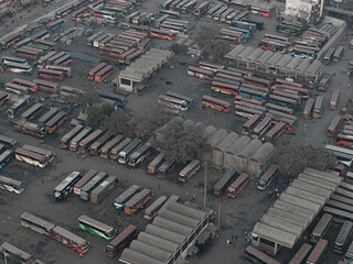 Dhaka, Bangladesh - 19 May 2025: Aerial view of bustling cityscape with public buses and a busy terminal, Dhaka, Dhaka, Bangladesh.