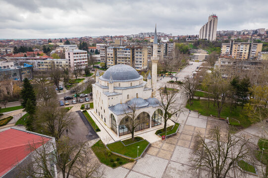 Aerial view of ibrahim pasha mosque in a cultural square surrounded by trees and buildings, Razgrad, Razgrad, Bulgaria.