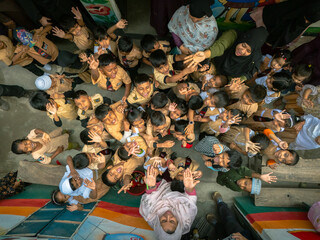 Dhaka, Bangladesh - 19 May 2025: Aerial view of a vibrant and colorful festival gathering of joyful children and people celebrating together, Dhaka, Dhaka, Bangladesh.