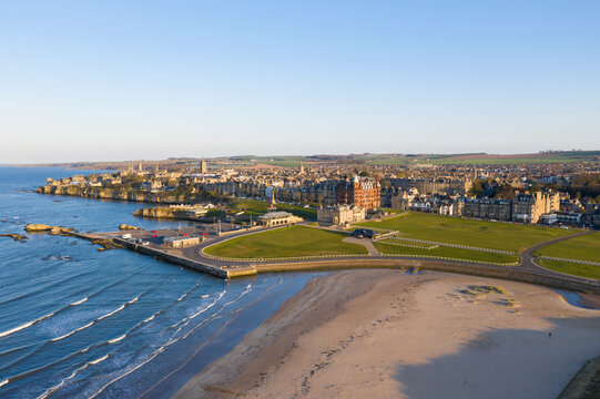 Aerial view of the historic Old Course and Royal and Ancient Clubhouse with beautiful coastline and sandy beach, St Andrews, Fife, Scotland.
