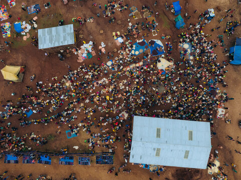 Aerial view of a bustling tribal market with colorful stalls and tents, Kako, Southern Nations Nationalities and Peoples' Region, Ethiopia.