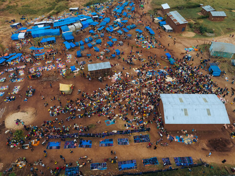 Aerial view of a bustling tribal market with colorful tents and stalls, Kako, Southern Nations Nationalities and Peoples' Region, Ethiopia.