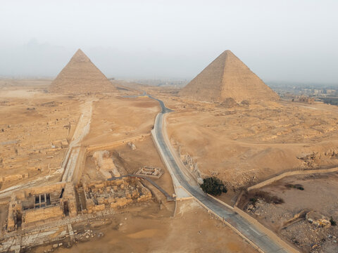 Aerial view of the Great Sphinx of Giza and the Great Pyramid in the desert landscape, Nazlet el-Samman, Al Ahram, Giza, Egypt.