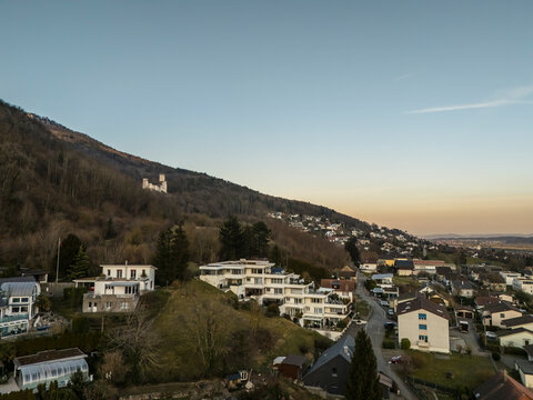 Aerial view of Castle Neu Bechburg surrounded by picturesque houses and tranquil valley at sunset, Oensingen, Solothurn, Switzerland.