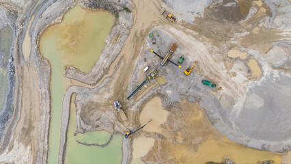 Aerial view of industrial quarry with machinery and water, St Ann's Chapel, Gunnislake, England.