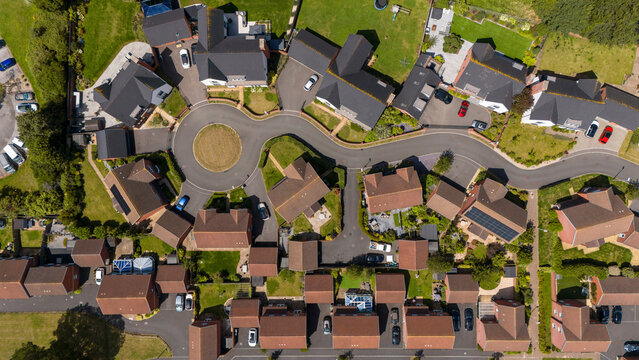 Aerial view of a picturesque suburban neighborhood with modern homes and organized streets, Exeter, United Kingdom.