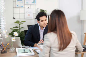 Financial Consultation. Professional discussing strategies in a modern office.
