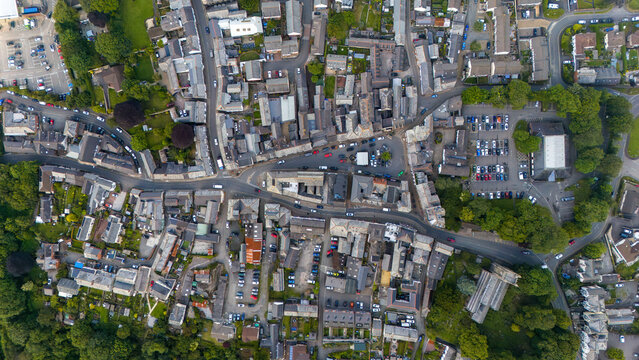 Aerial view of a beautiful town with residential buildings, roads, and greenery, Holsworthy, United Kingdom.