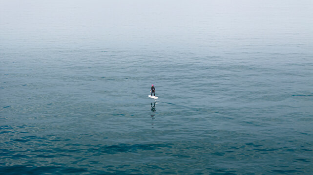 Aerial view of flite boarding over the calm and serene ocean at Watermans Bay, Perth, Western Australia.
