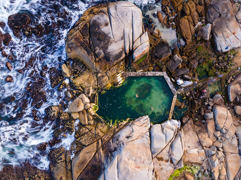 Aerial view of Saunders Rock tidal pool in summer at Bantry Bay, Atlantic Seaboard, Cape Town, South Africa.